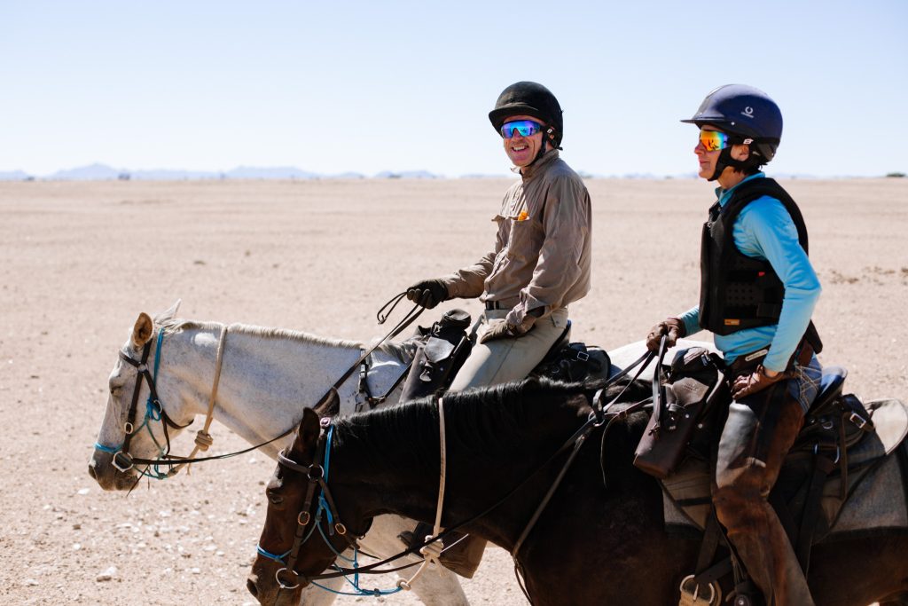Riders in their horseback riding safari helmet and goggles 